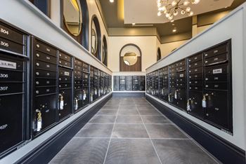 A room filled with lots of cabinets and a chandelier